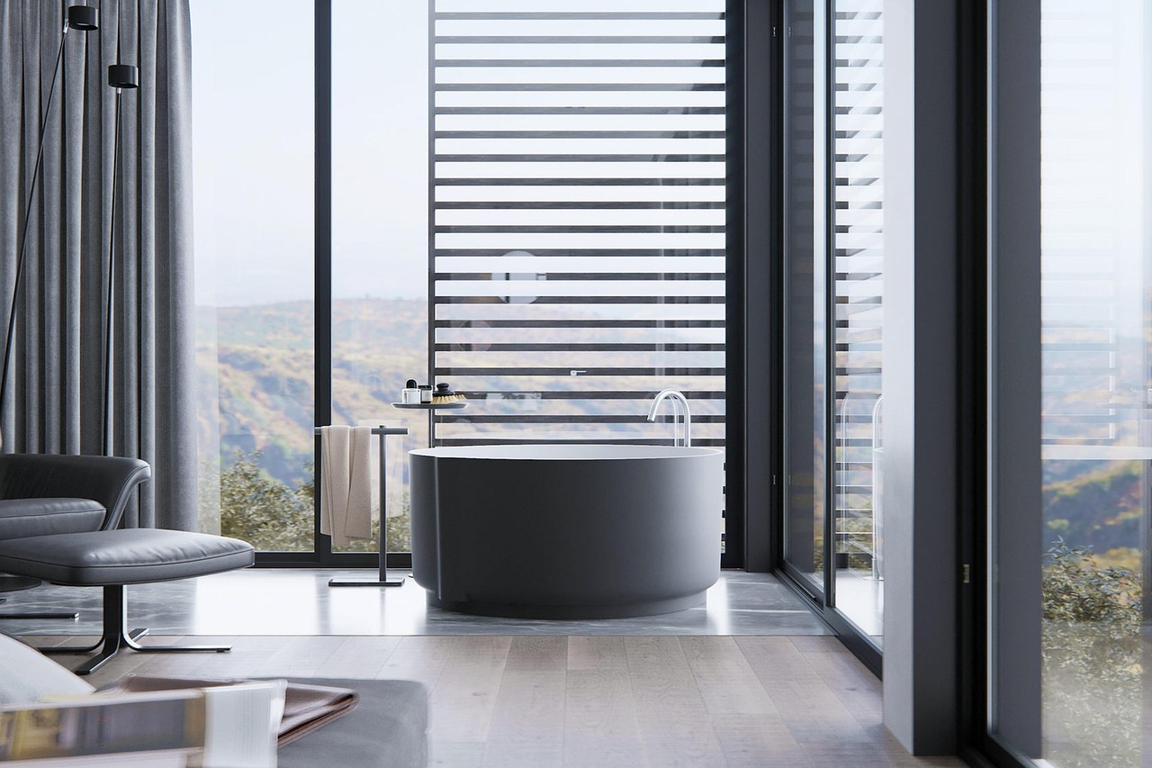 Remodeled bathroom with hexagon floor tile, a pedestal sink and a clawfoot tub